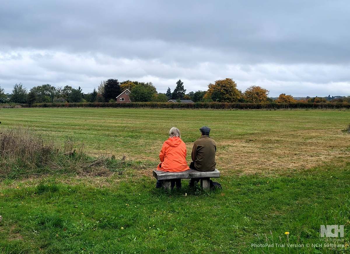 2 people sitting on bench